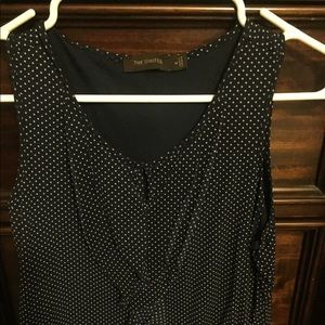 The limited sleeveless blouse with ruffle detail